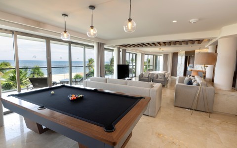 a pool table in a living room