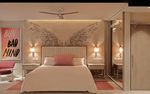 a bedroom with a mirror and a bed