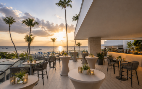 a restaurant with tables and chairs and palm trees