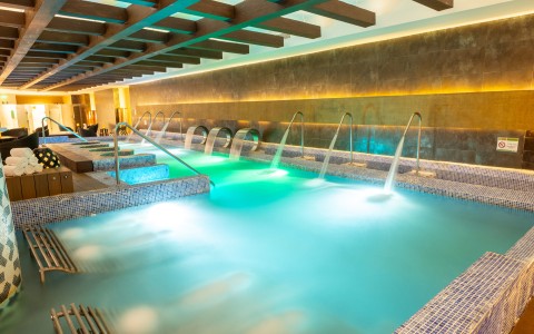 a pool with water and a couple of people in it