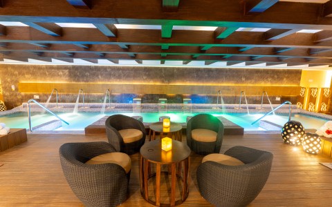 a pool with a table and chairs