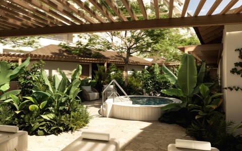 a hot tub with a pool and plants around it