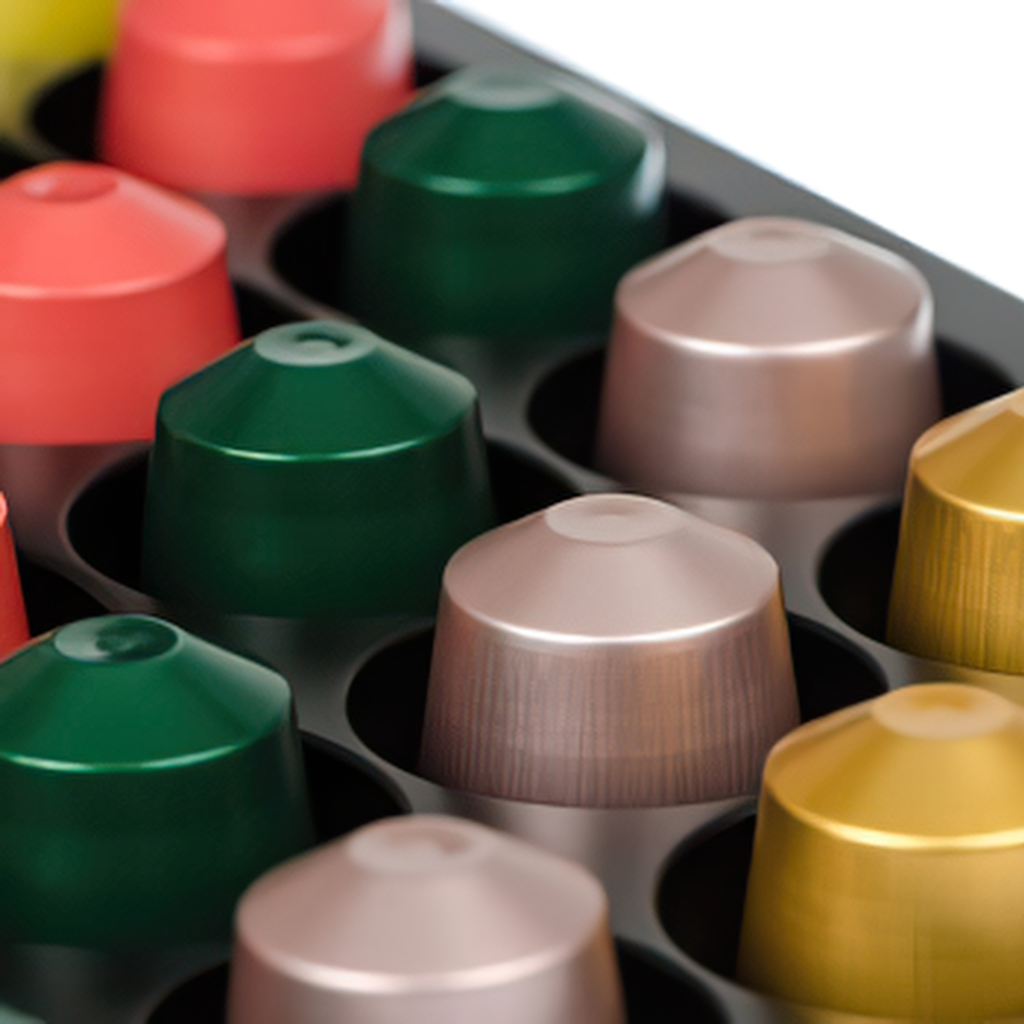 a close up of a tray of colorful capsules