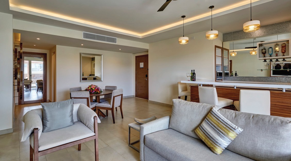 a living room with a couch and chairs