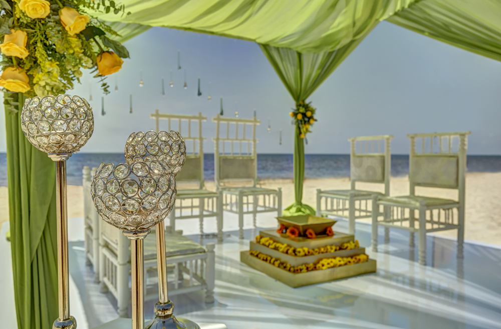 a wedding ceremony with chairs and flowers