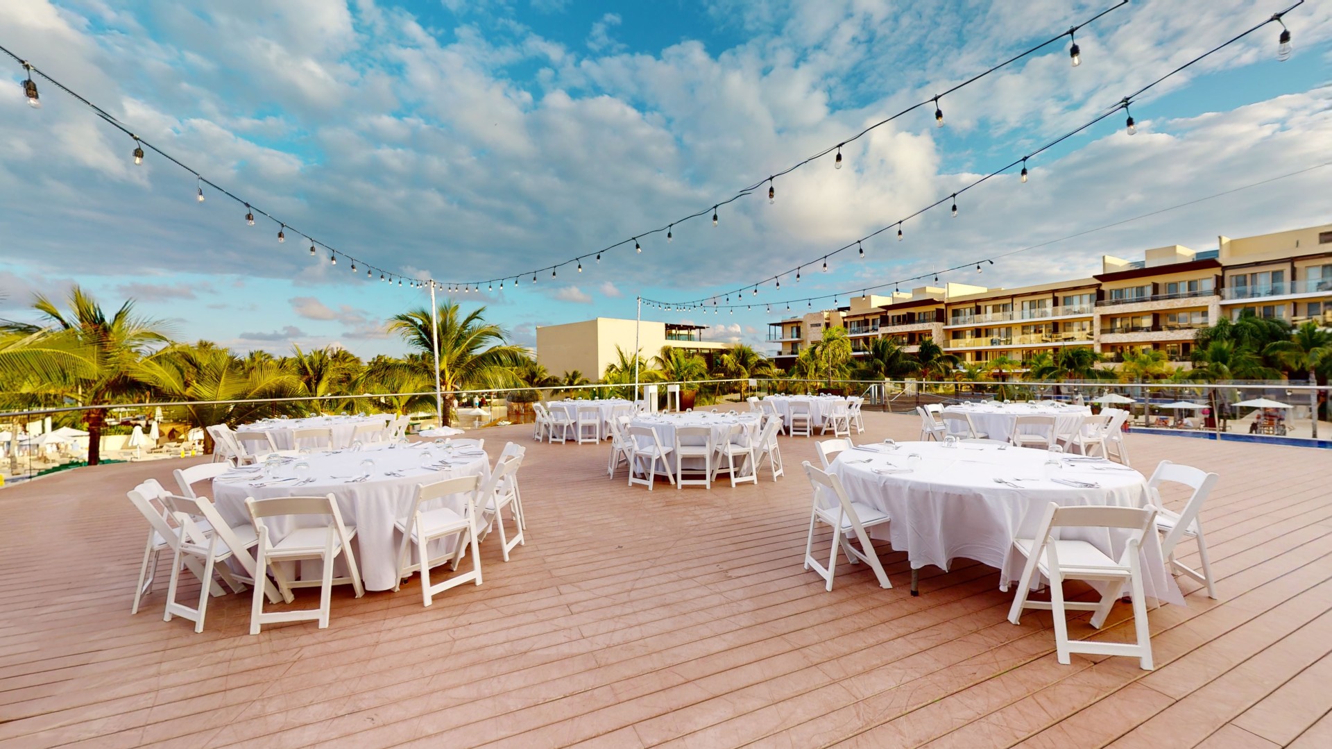 a group of tables and chairs on a deck