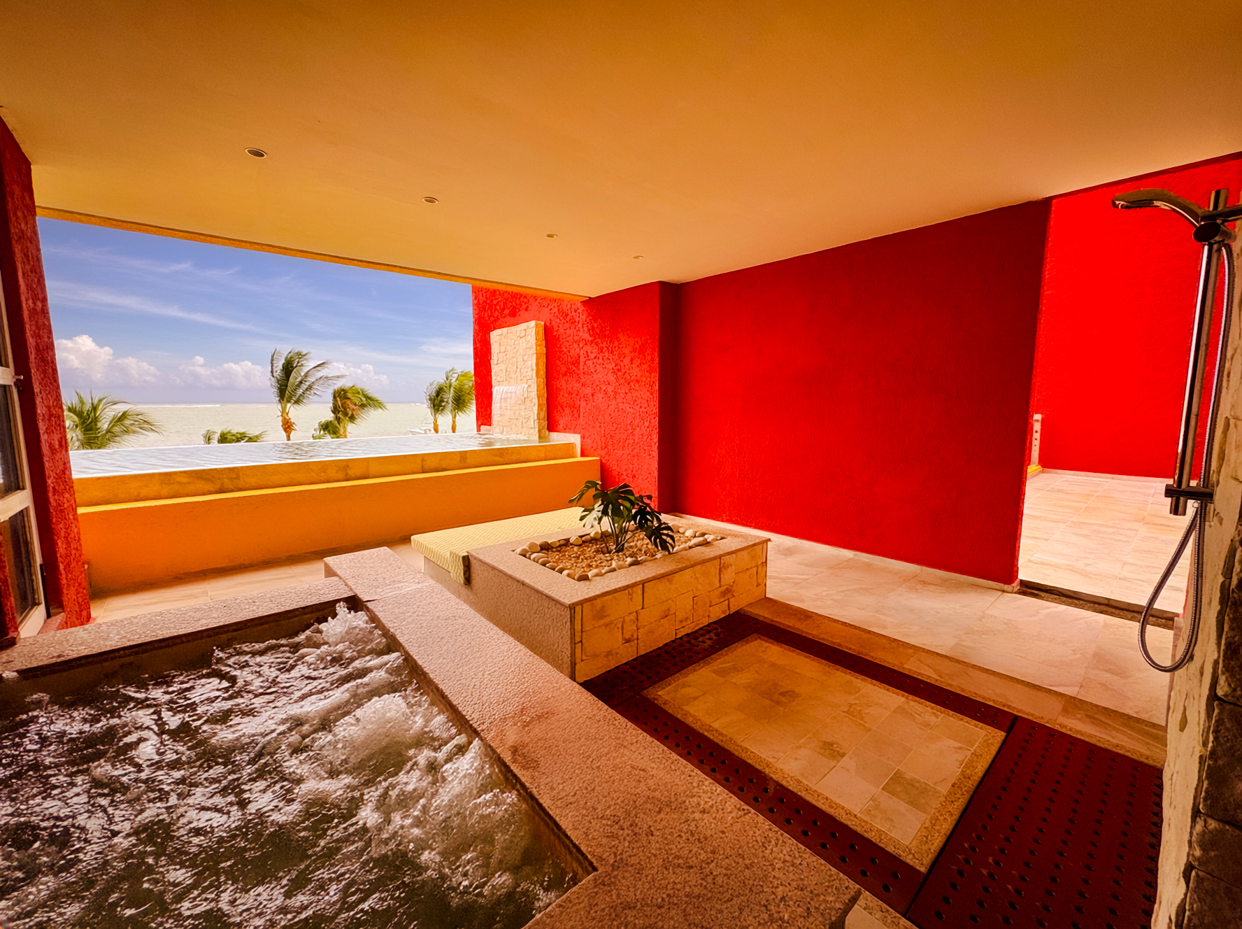 a room with a hot tub and a large window