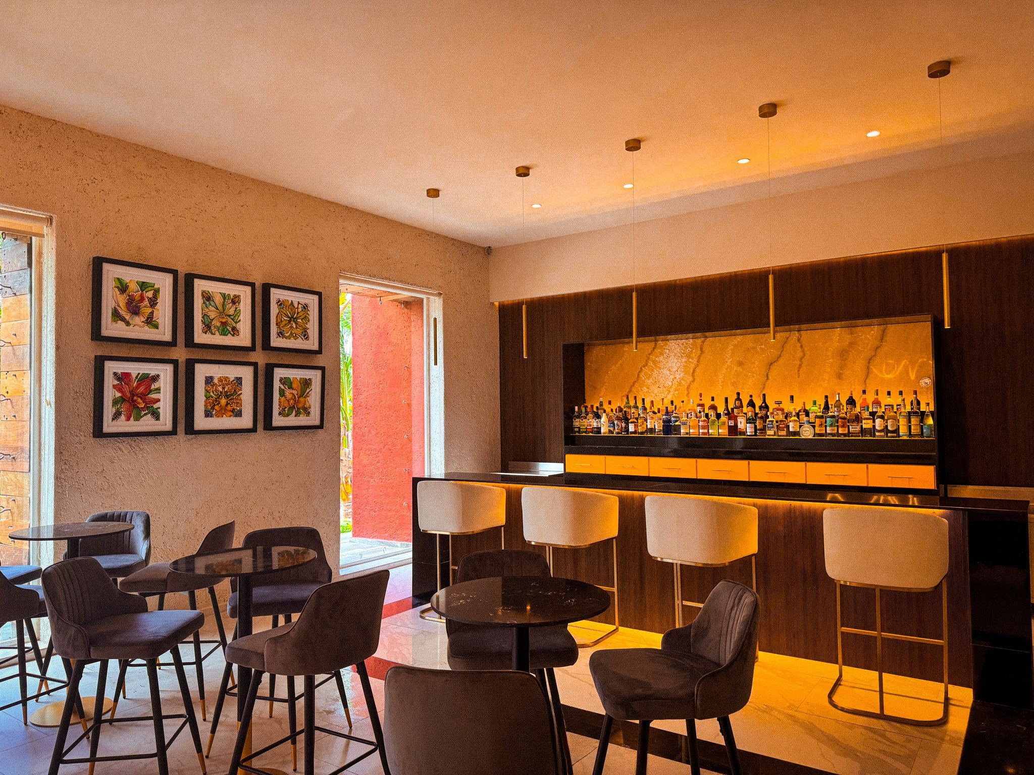 a bar with chairs and tables