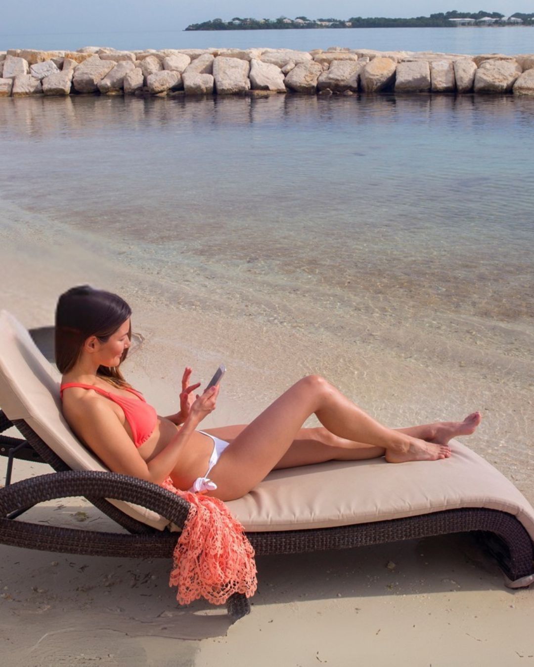 a woman in a garment on a beach