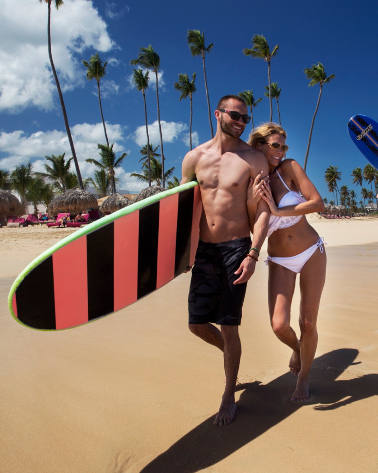 a man and woman in a garment on a beach