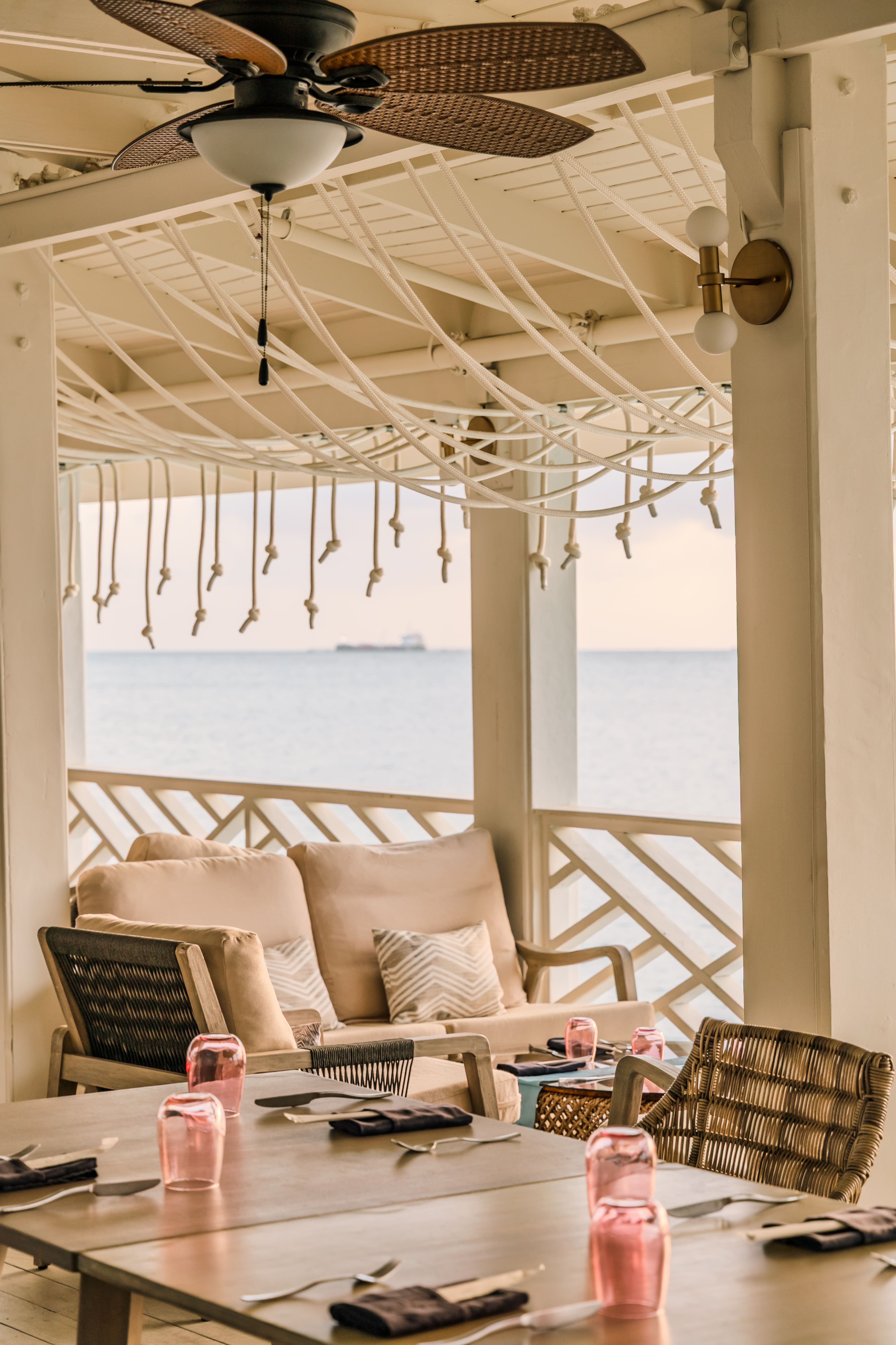 a table and chairs on a porch