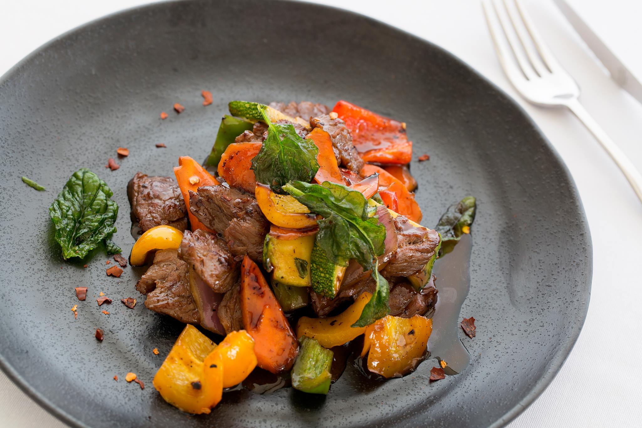 a plate of food with fork and knife