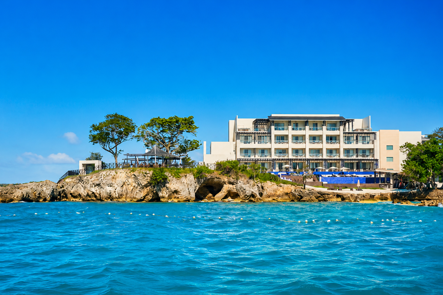 a building on a rocky island by water