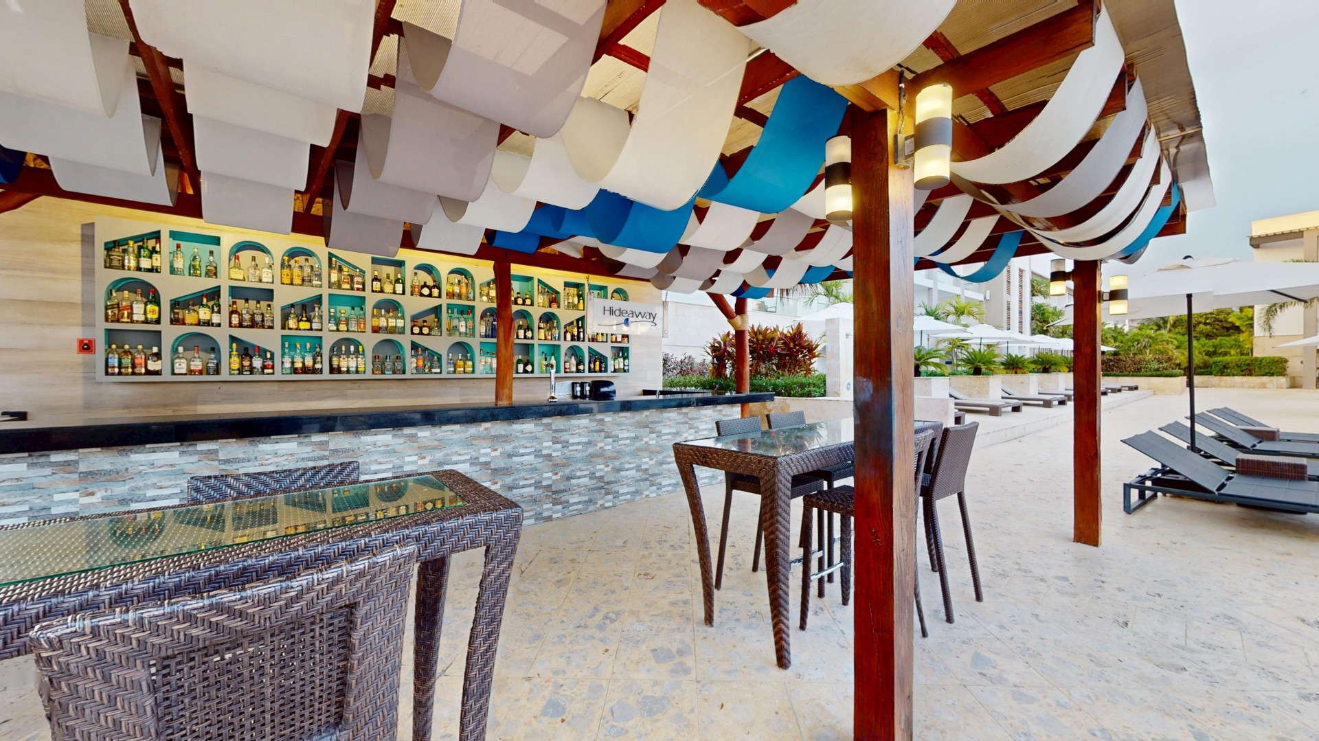 a patio with tables and chairs