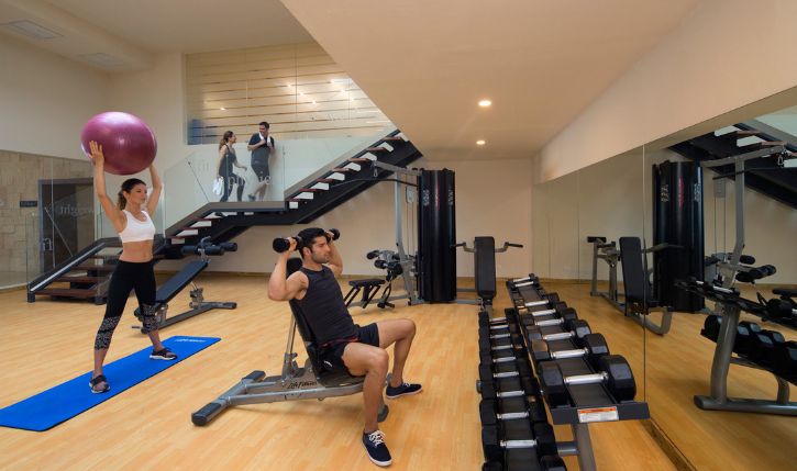 a man lifting weights in a gym