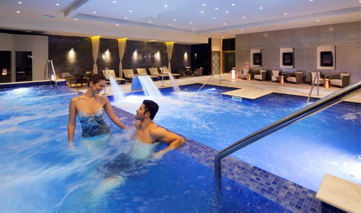 a man and woman in a pool