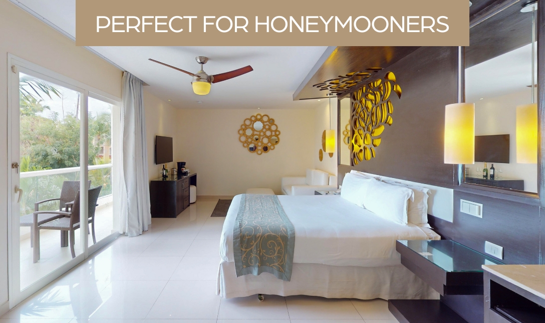 a room with a bed and a ceiling fan