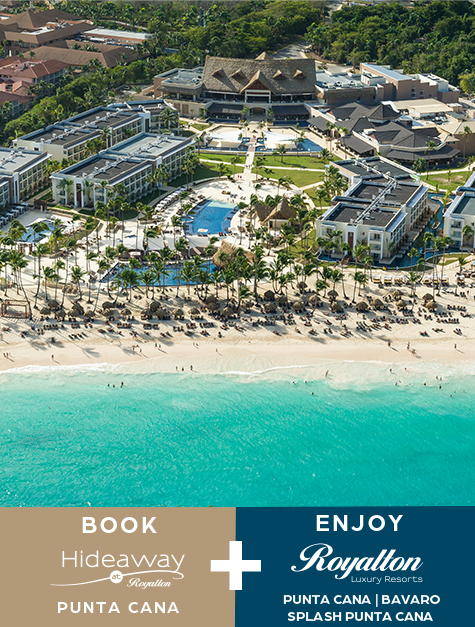a beach with buildings and palm trees