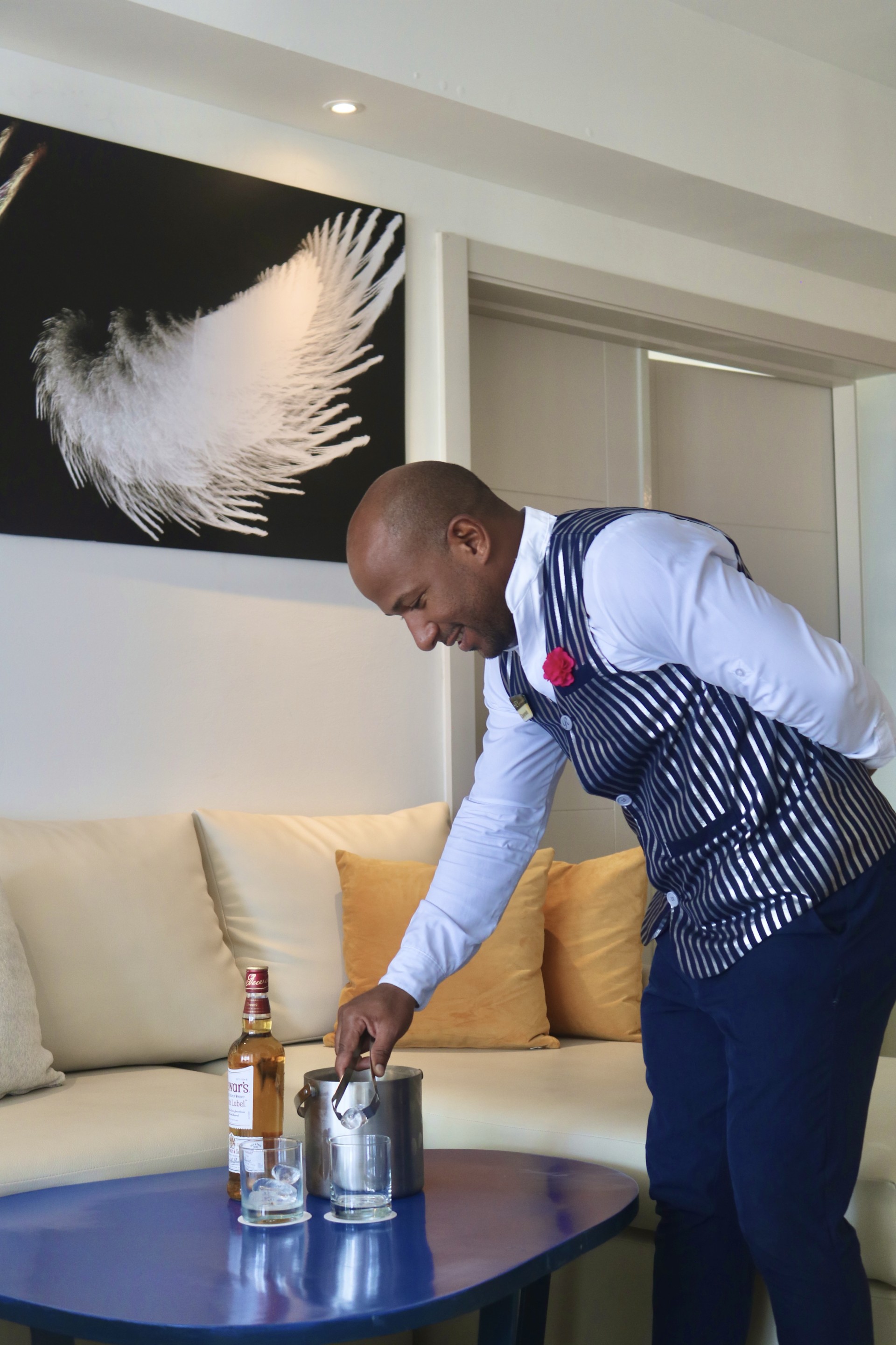 a man in a striped vest cooking