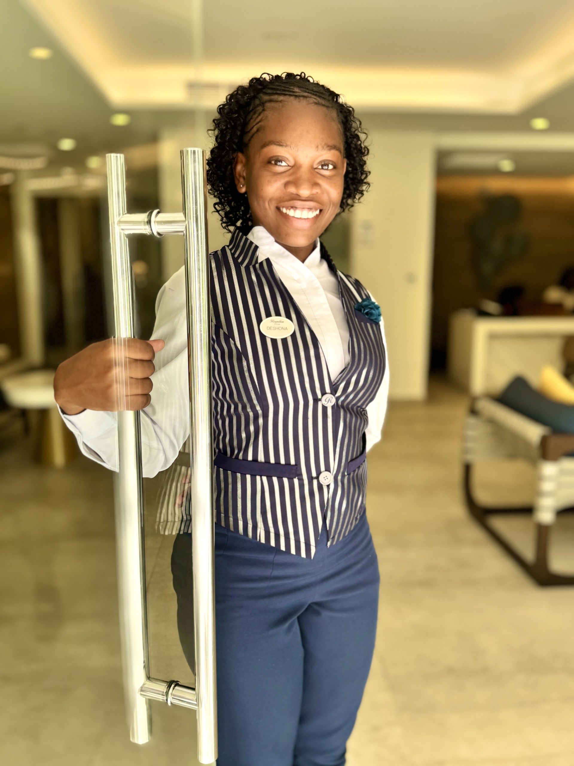 a woman holding a door handle