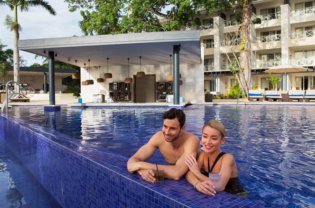 a man and woman in a pool