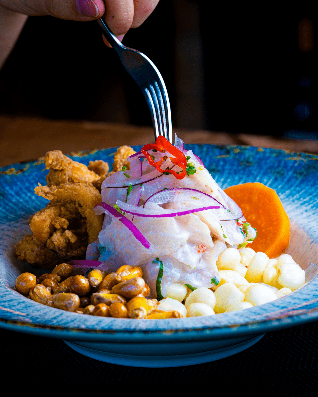 a bowl of food with a fork