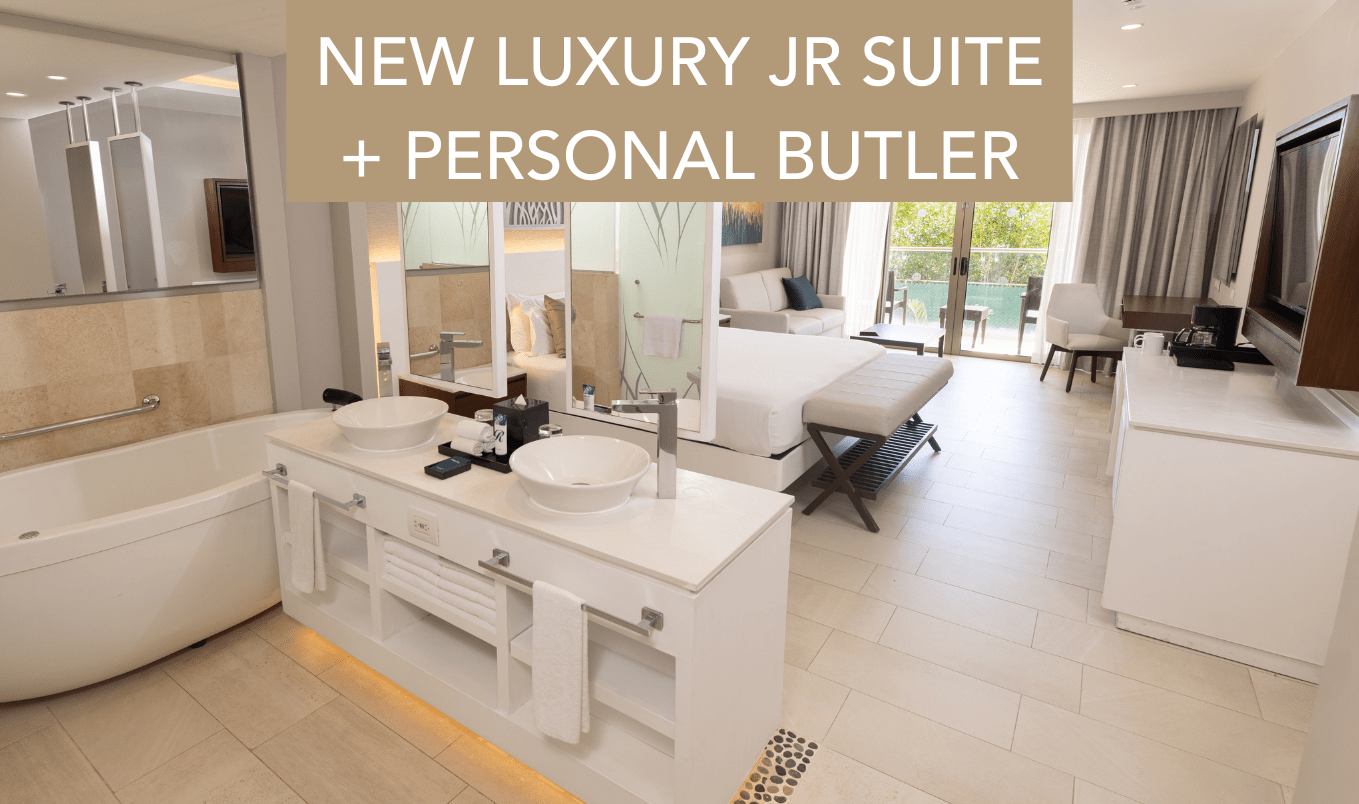 a bathroom with a double bed and a double sink