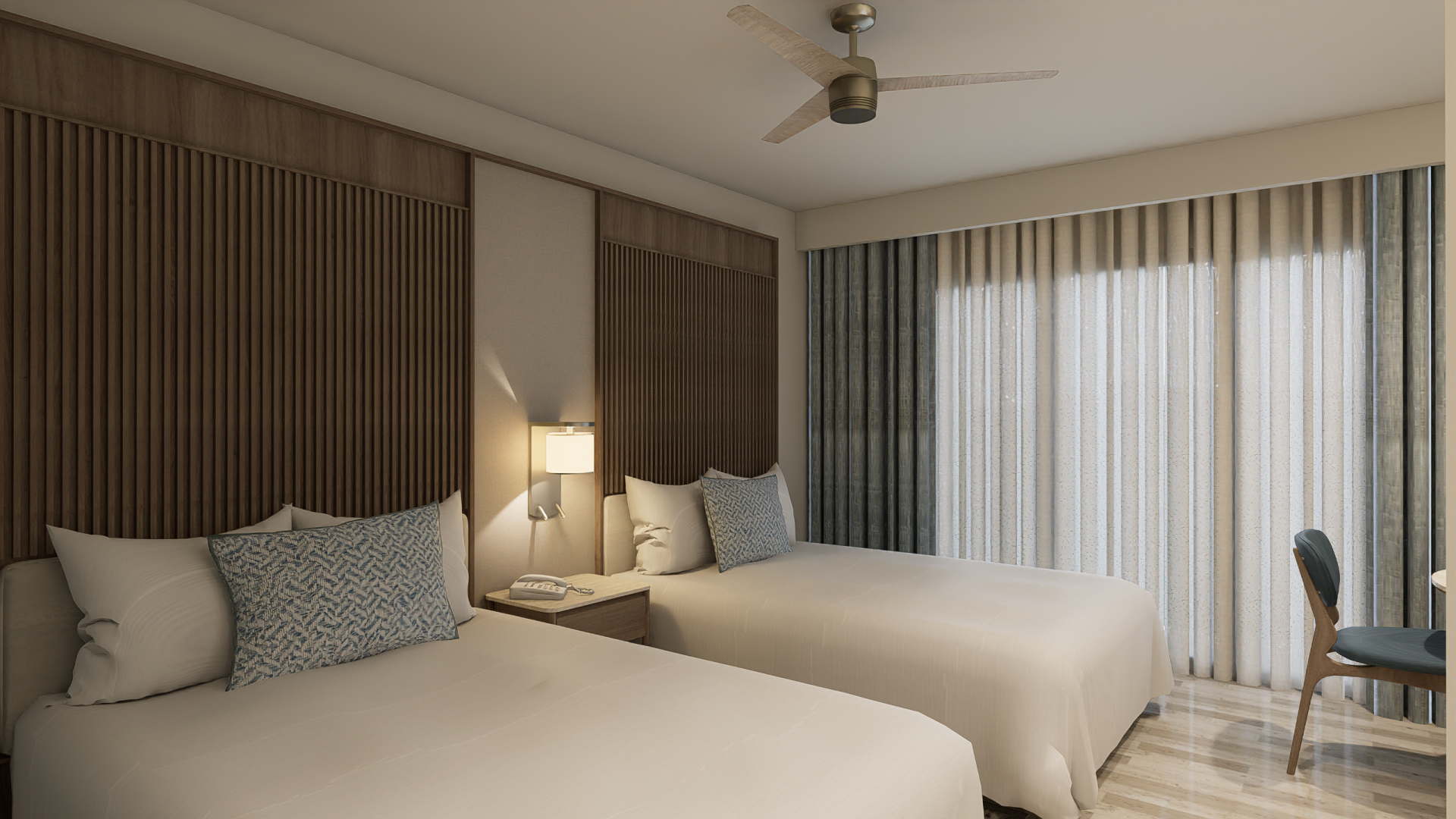 a room with two beds and a fan
