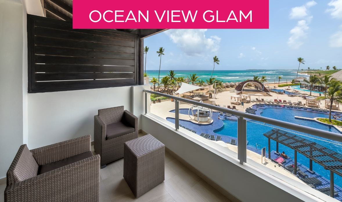 a balcony with chairs and a pool overlooking the ocean