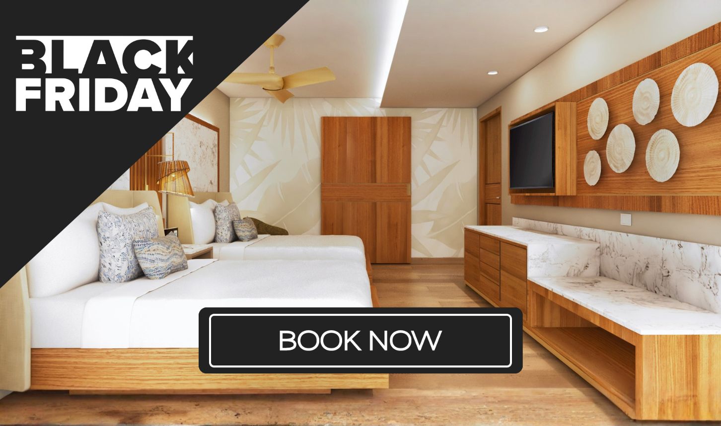 a room with two beds and a tv