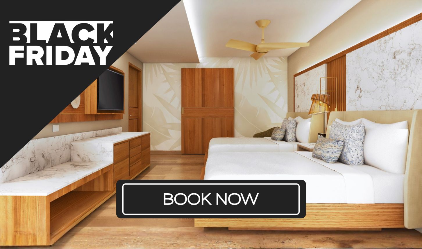 a room with two beds and a tv