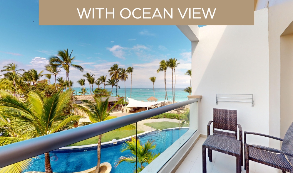 a balcony with a view of a beach and palm trees