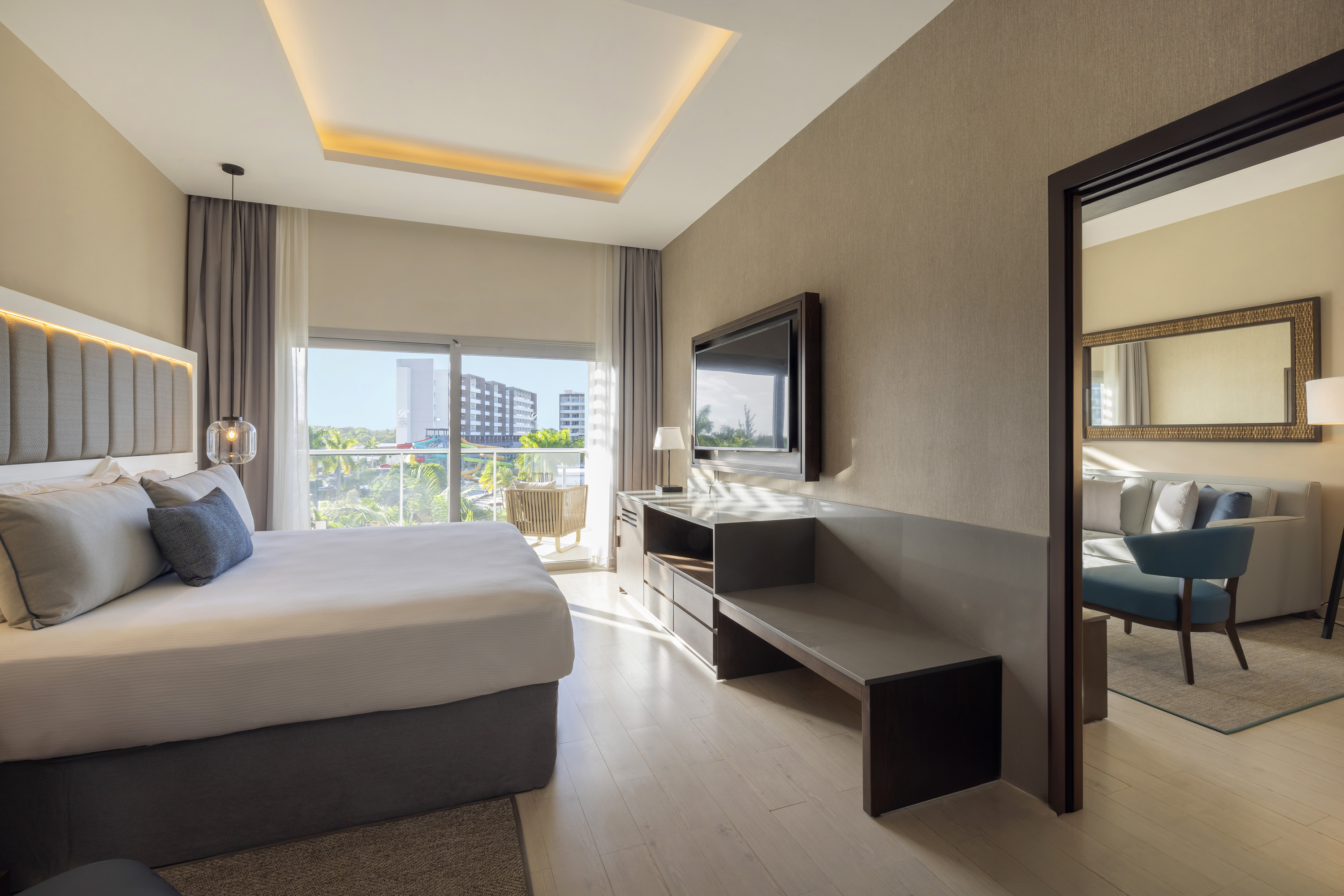 a bedroom with a television and a bed