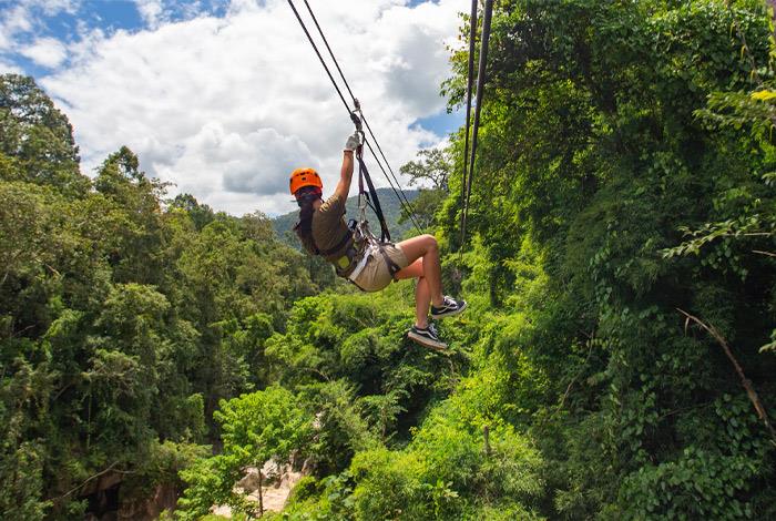 a person in a zip line