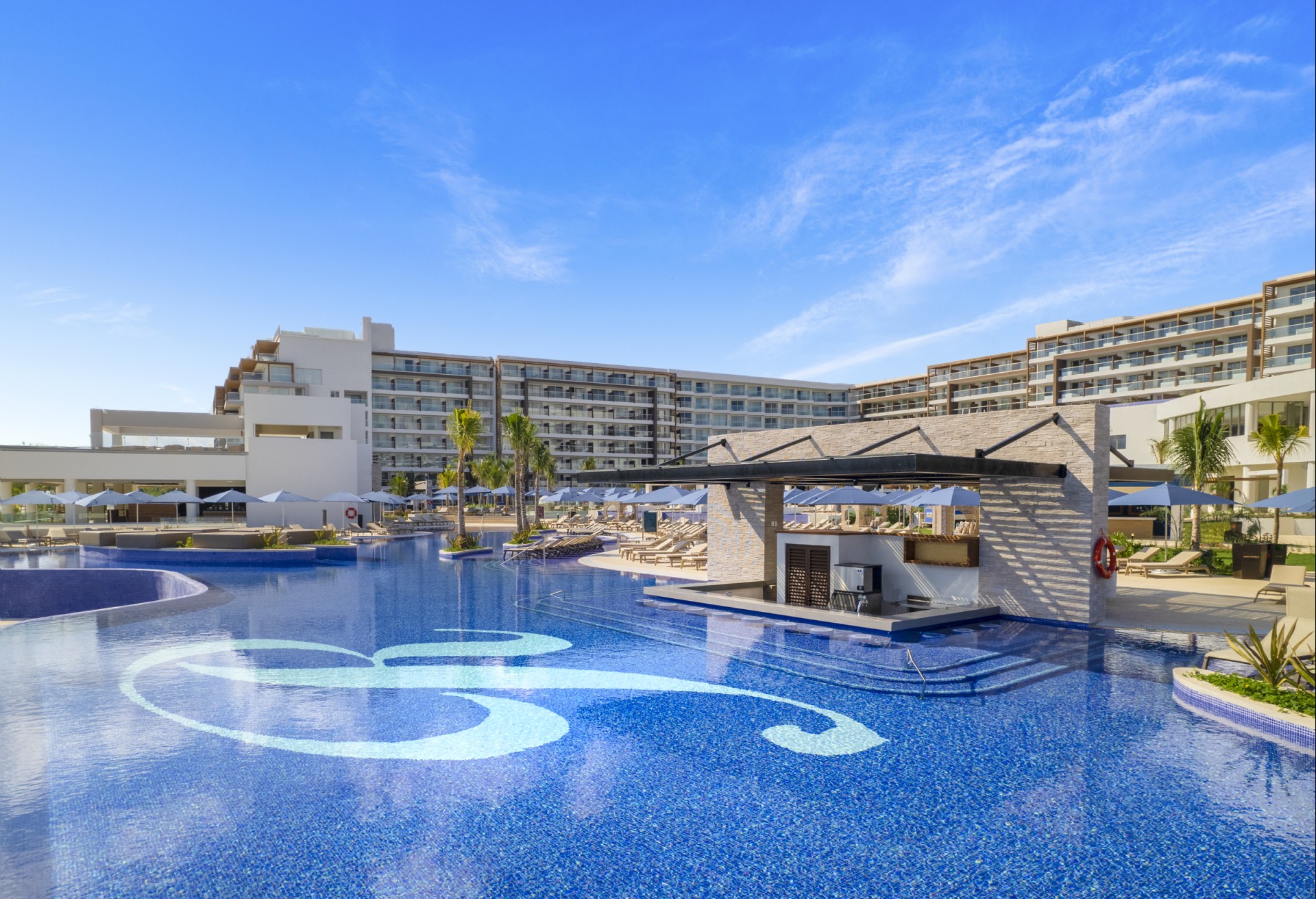 a pool with a large building in the background