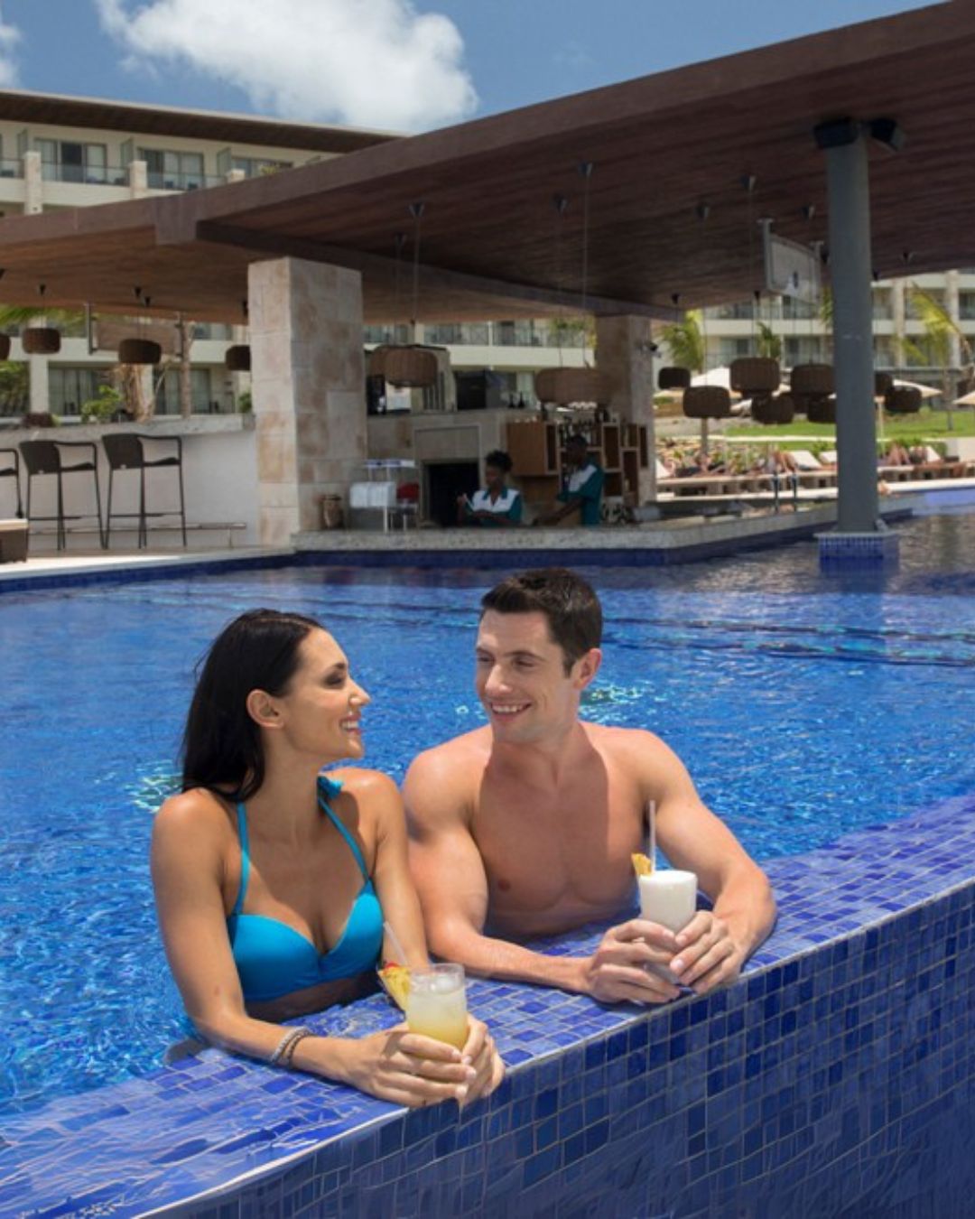 a man and woman in a pool