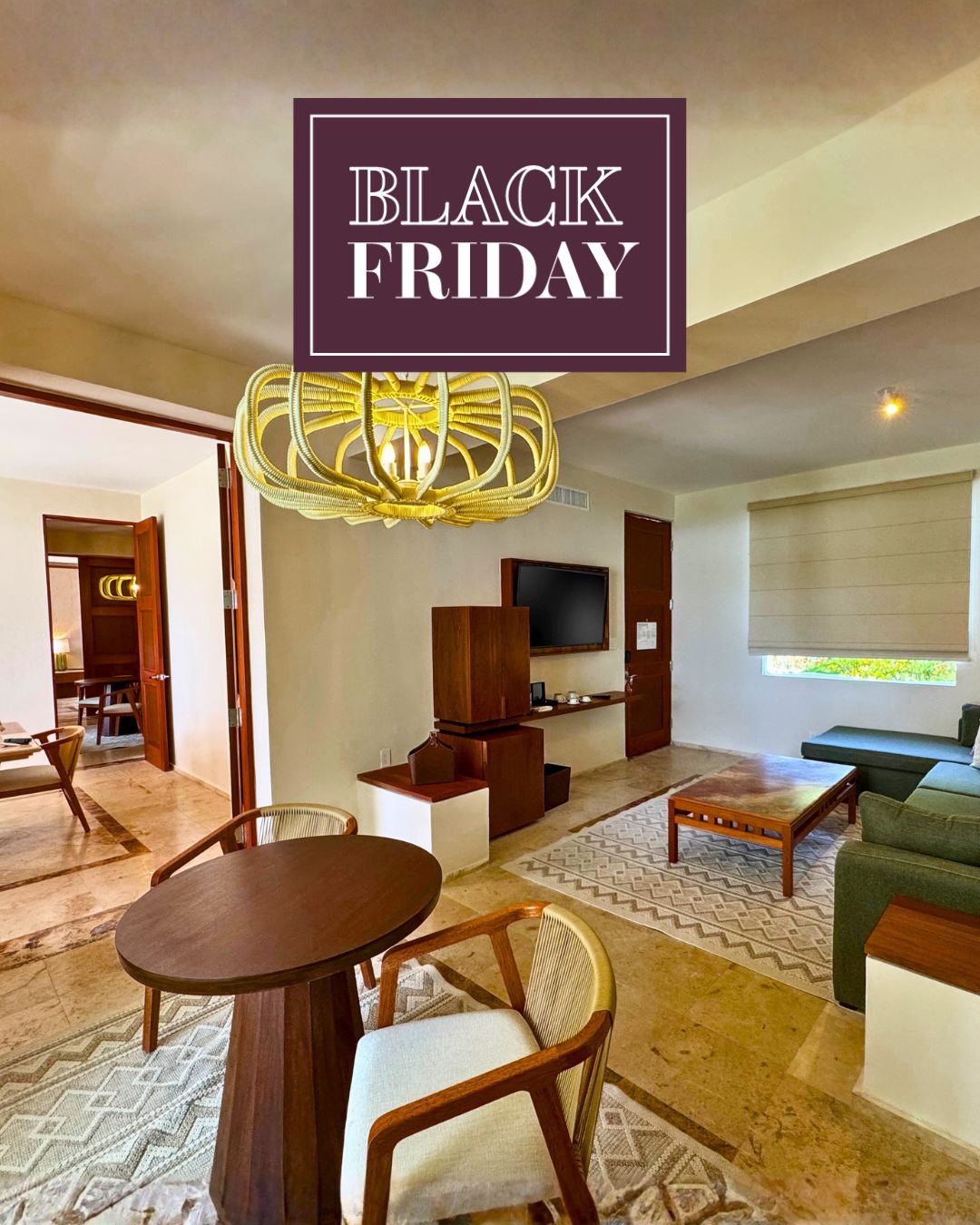 a room with a table and chairs and a tv