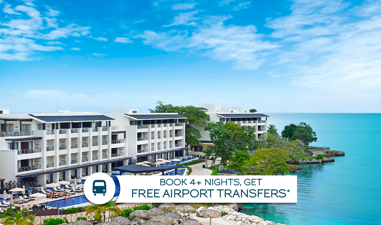 a group of buildings next to a body of water