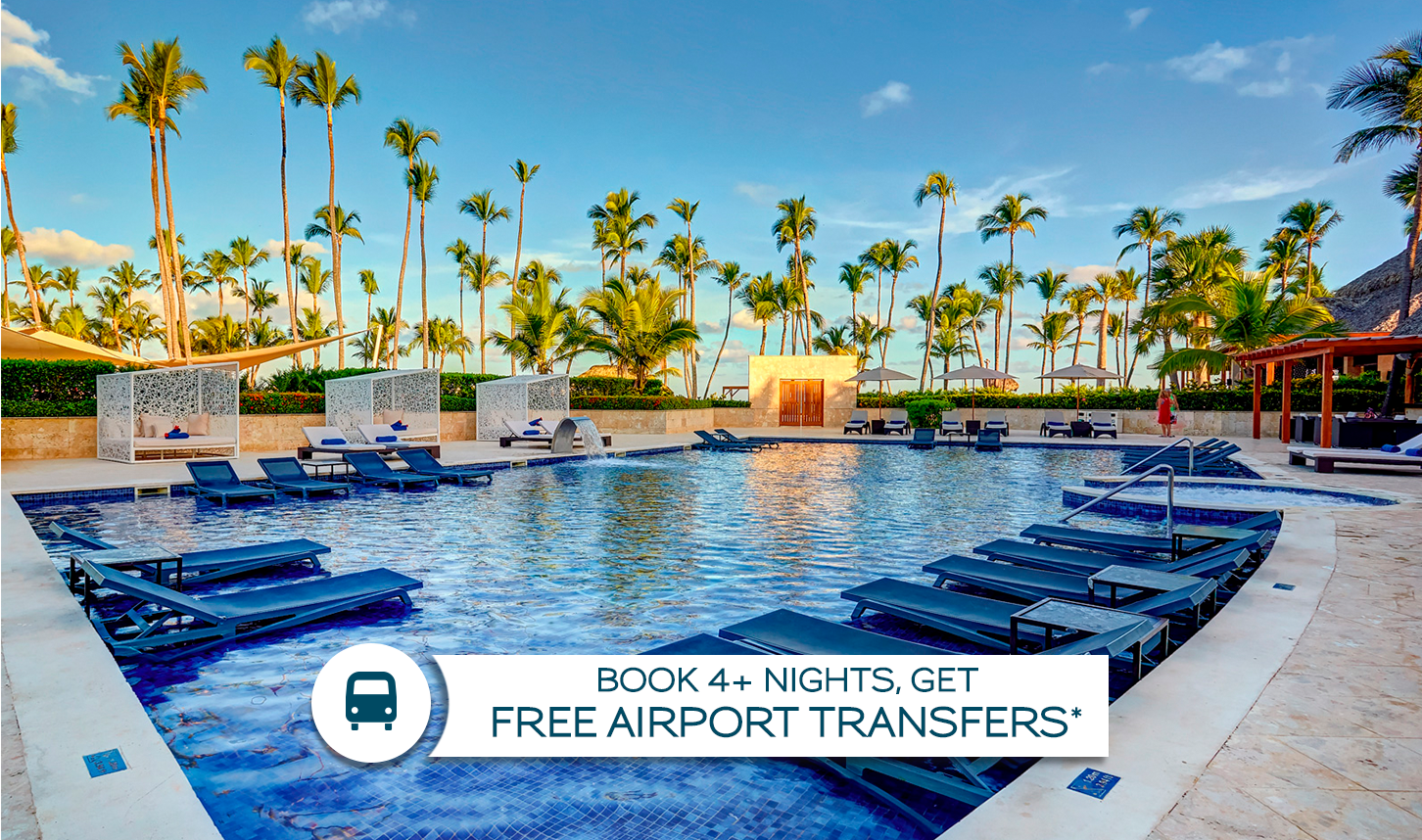 a pool with lounge chairs and palm trees