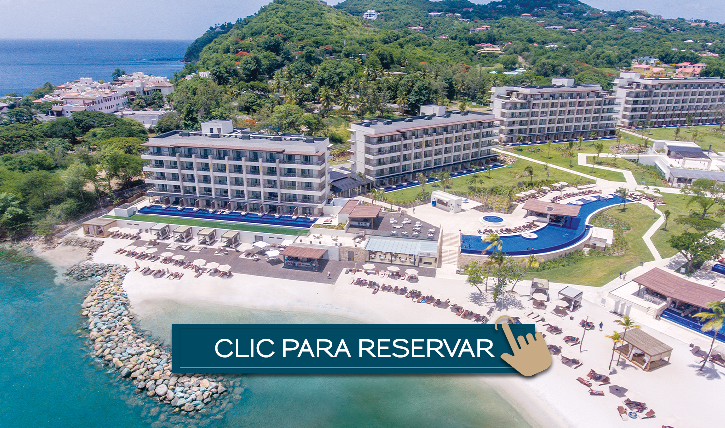 a resort with a beach and a body of water