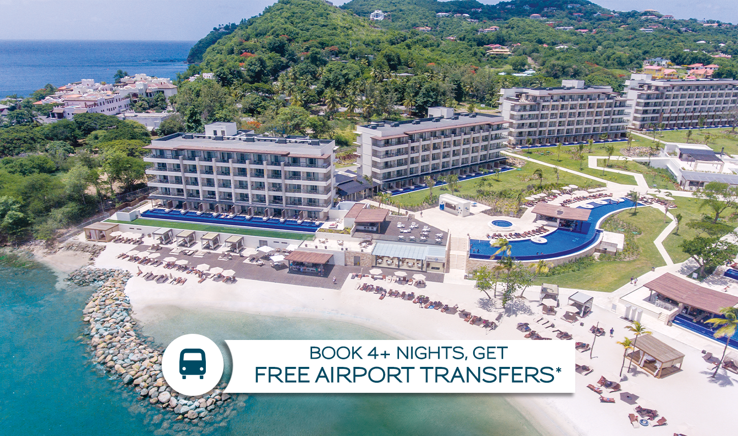 a group of buildings next to a beach