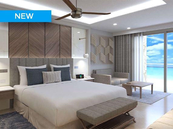 a bedroom with a large bed and a large window