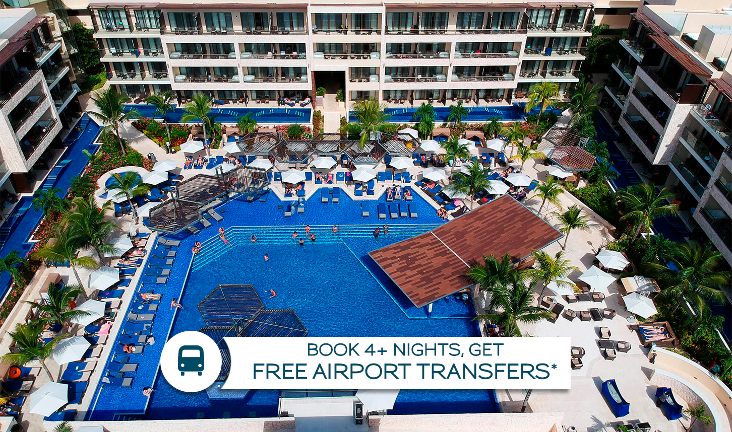 a swimming pool with umbrellas and palm trees