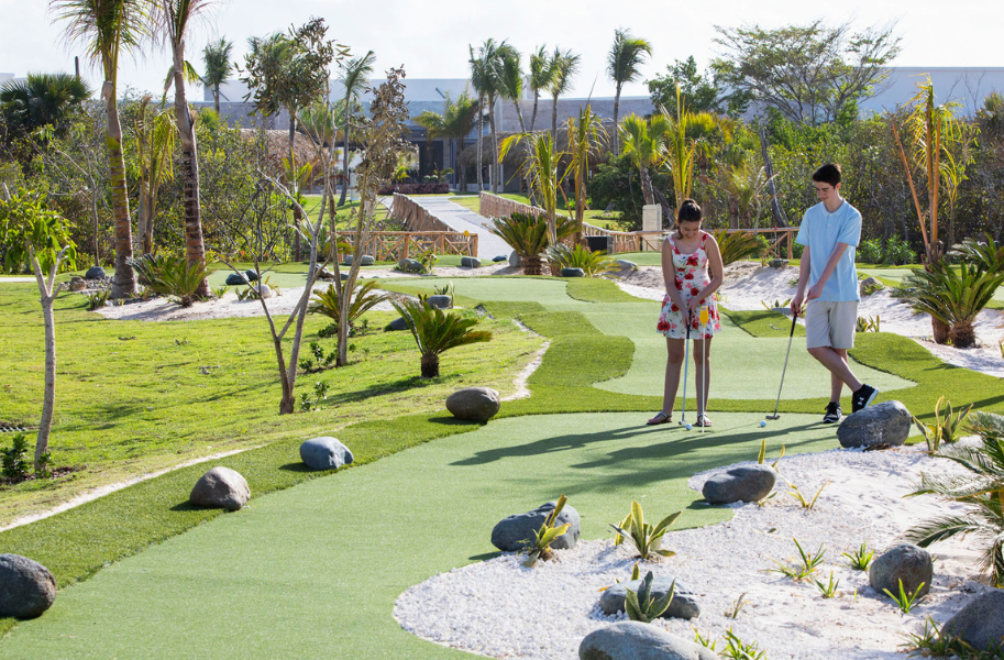a man and woman playing golf