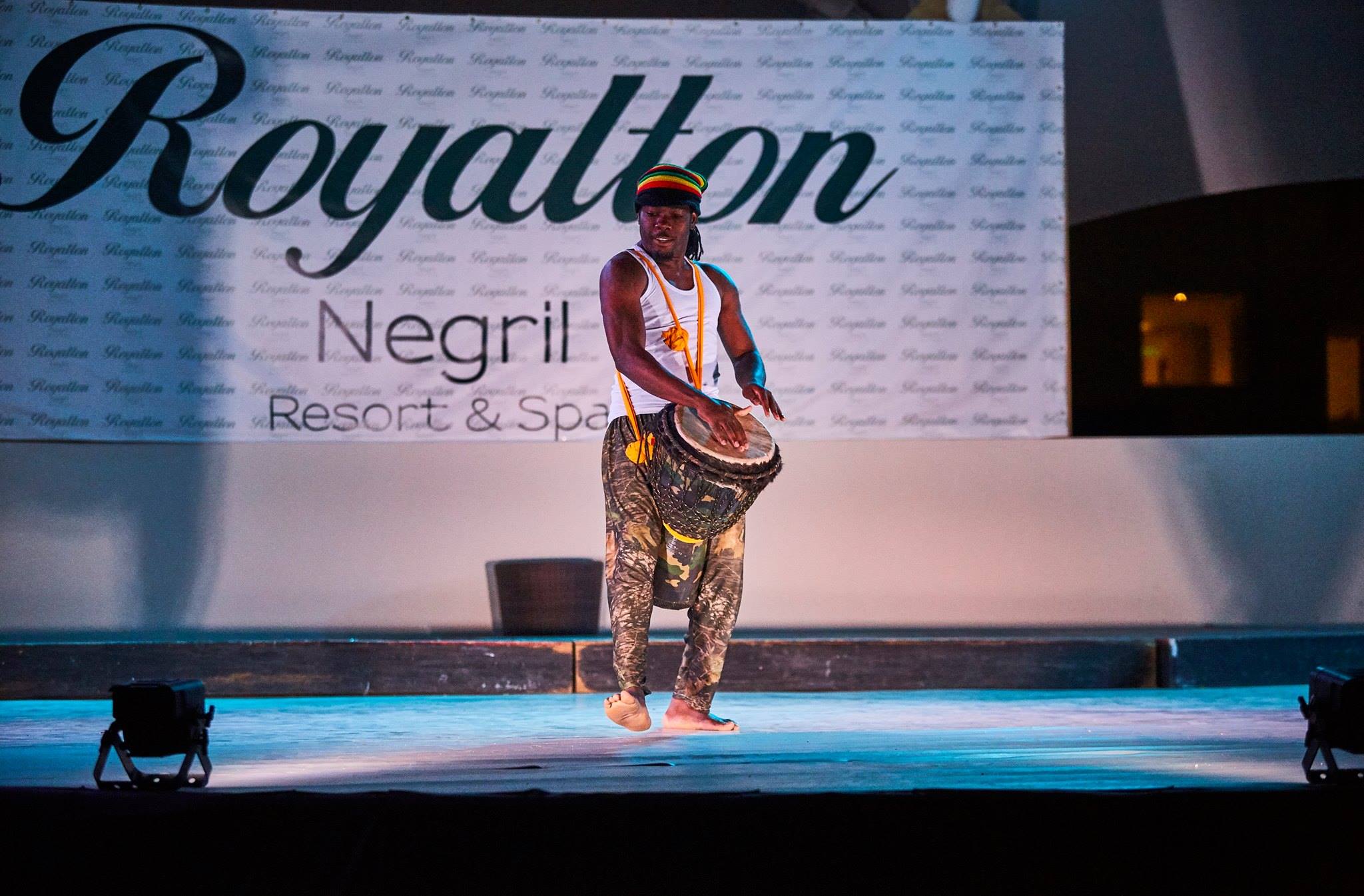 a man on stage with drums