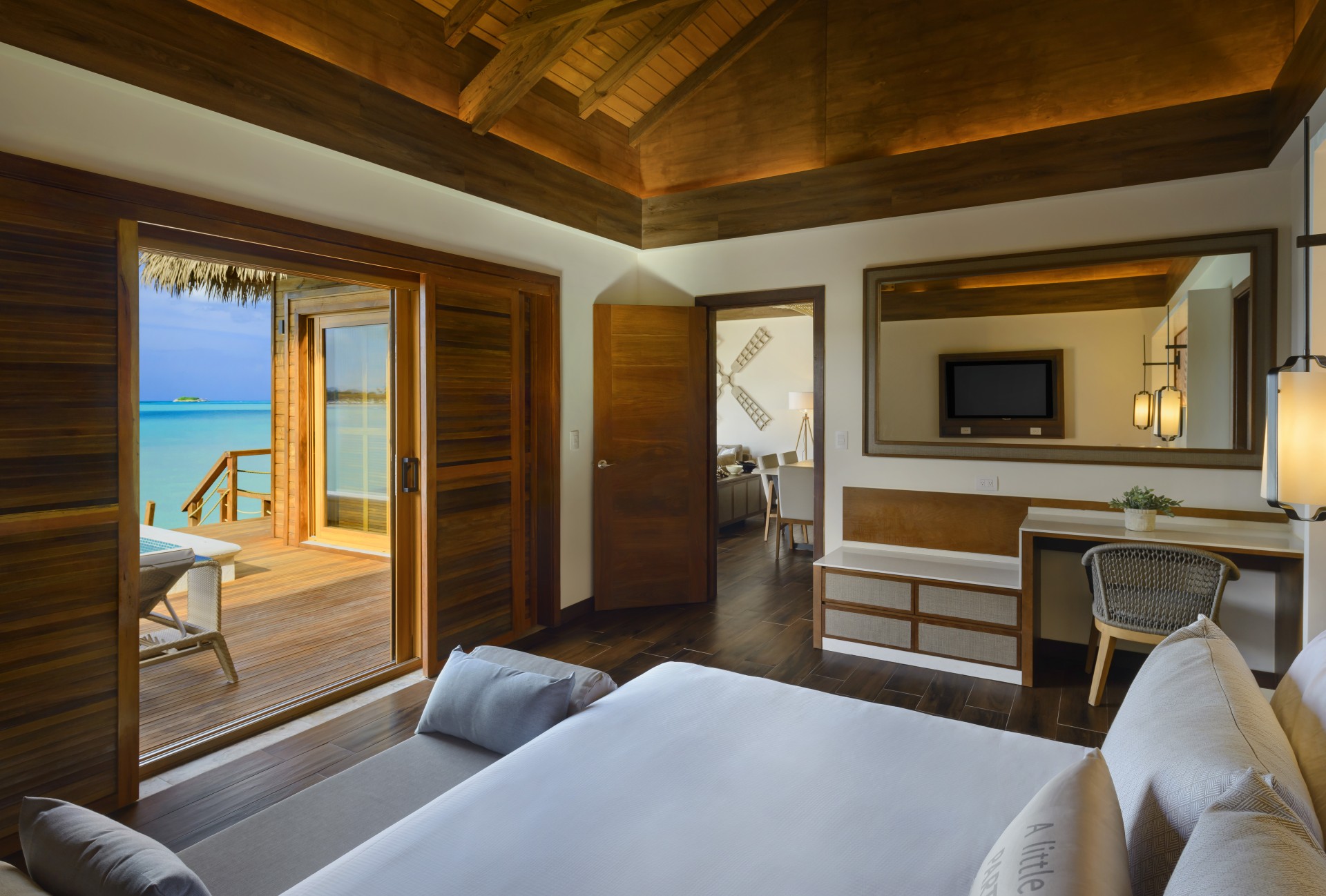 a room with a bed and a glass door