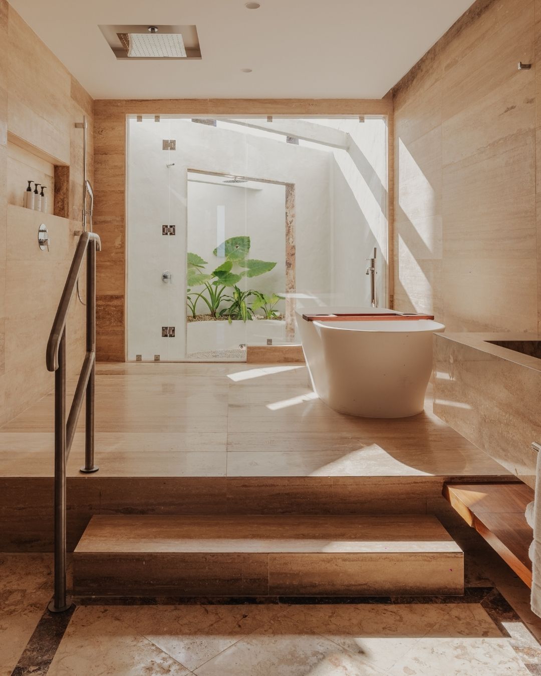 a bathroom with a tub and stairs