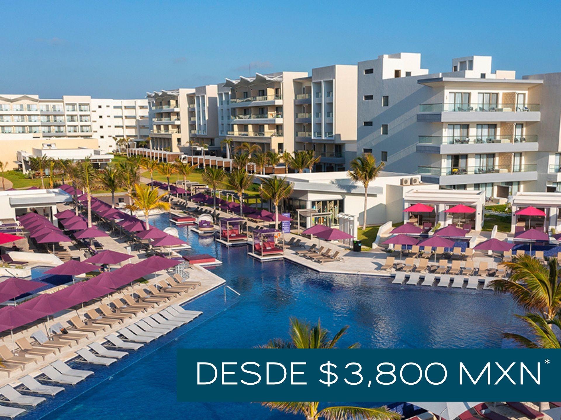 a pool with lounge chairs and umbrellas in a resort