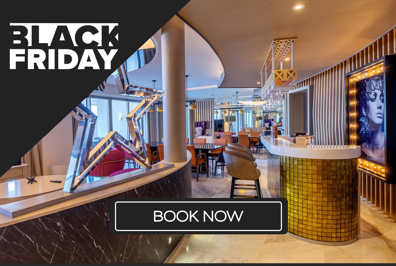 a restaurant with a bar and chairs