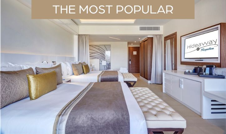 a room with two beds and a mirror